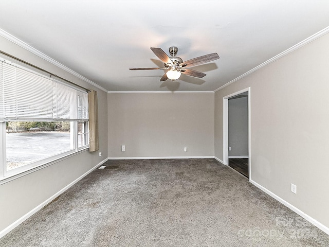 spare room featuring ceiling fan, crown molding, and carpet