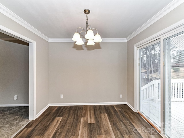 unfurnished dining area with crown molding, dark wood-type flooring, and an inviting chandelier