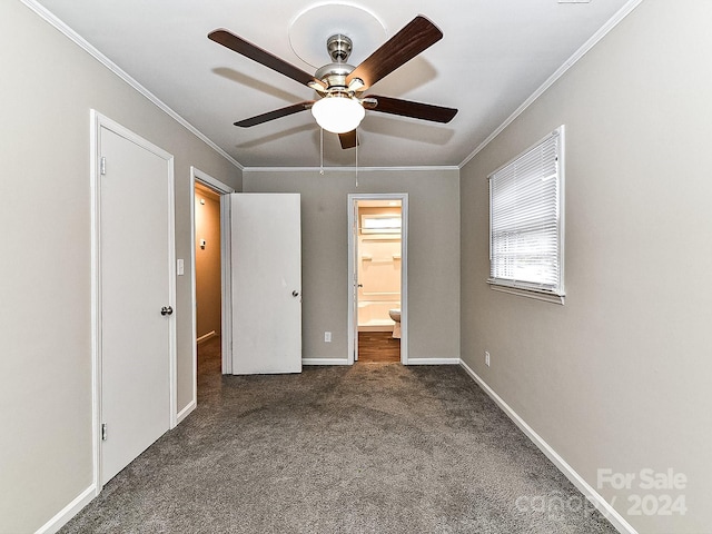 unfurnished bedroom with dark colored carpet, ceiling fan, ornamental molding, and connected bathroom