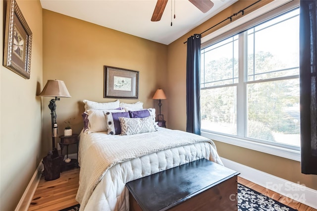 bedroom featuring hardwood / wood-style flooring and ceiling fan