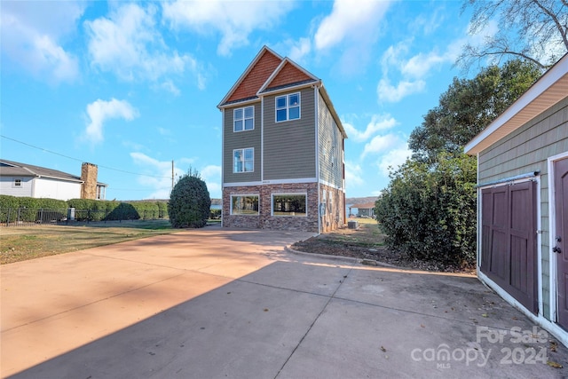 rear view of property with a yard