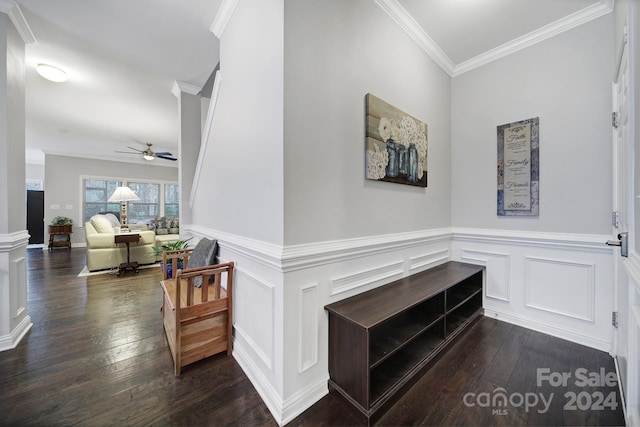 hall with hardwood / wood-style flooring and ornamental molding