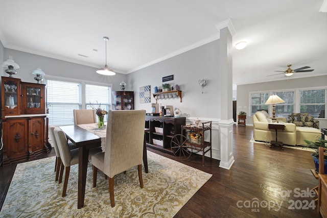 dining room featuring dark hardwood / wood-style flooring, ceiling fan, and ornamental molding