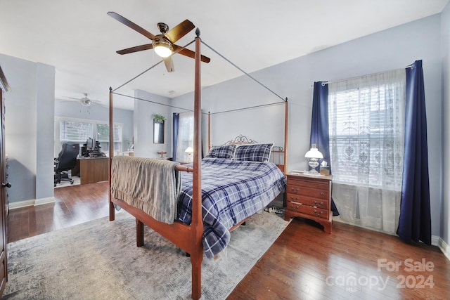 bedroom featuring ceiling fan and dark wood-type flooring