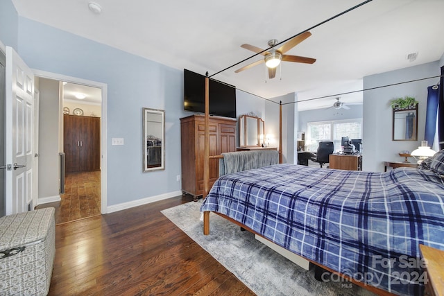 bedroom featuring ceiling fan and dark hardwood / wood-style flooring