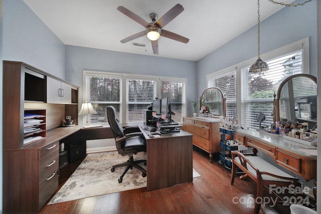 home office with dark hardwood / wood-style flooring and ceiling fan