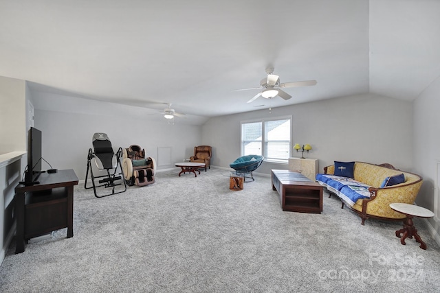 living room with ceiling fan, carpet floors, and vaulted ceiling