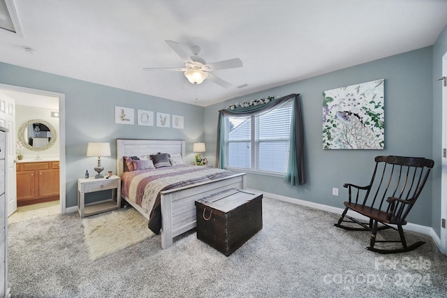 carpeted bedroom featuring ensuite bath and ceiling fan