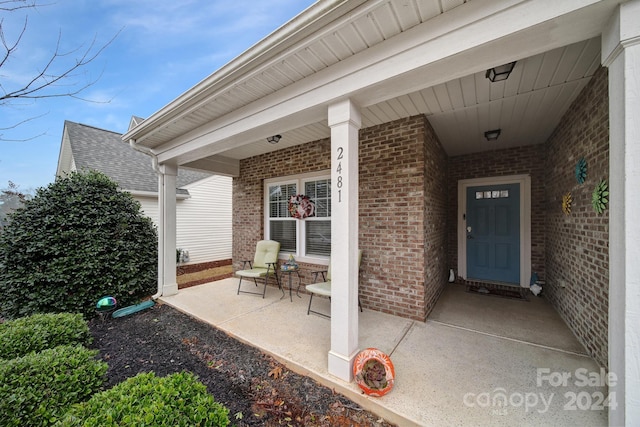 entrance to property with a porch