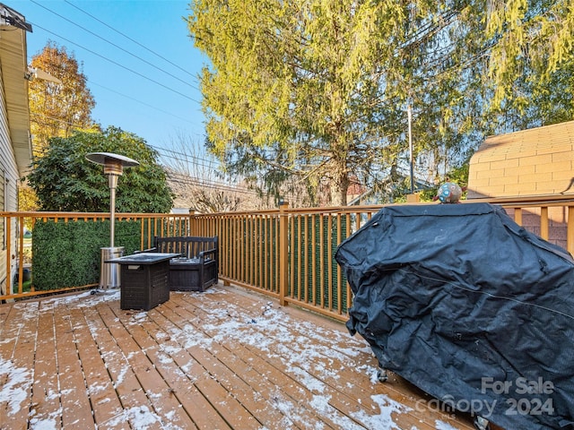 wooden deck with area for grilling