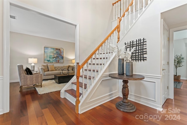 stairs with hardwood / wood-style flooring