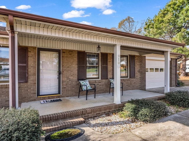 property entrance featuring a porch and a garage