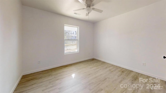 unfurnished room featuring ceiling fan and light hardwood / wood-style flooring