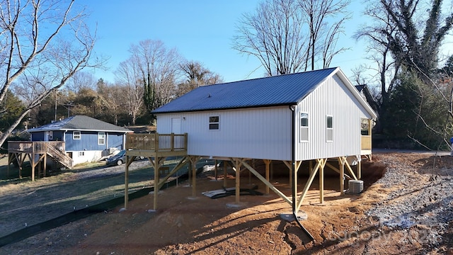 rear view of property featuring a carport