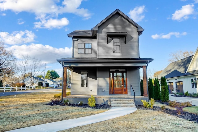 view of front of property featuring covered porch