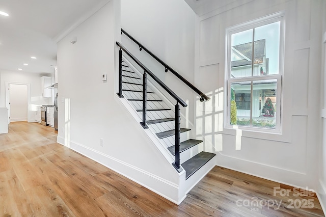 stairs with wood-type flooring