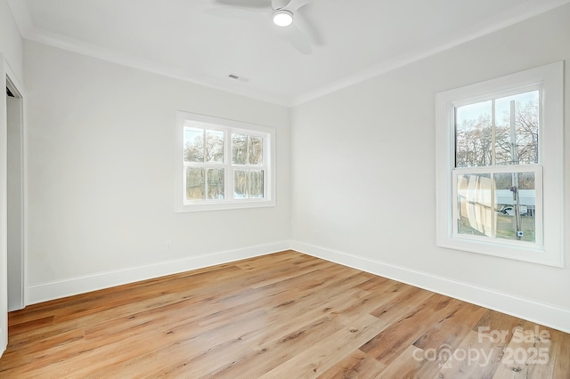 unfurnished bedroom featuring ceiling fan, crown molding, and light hardwood / wood-style flooring