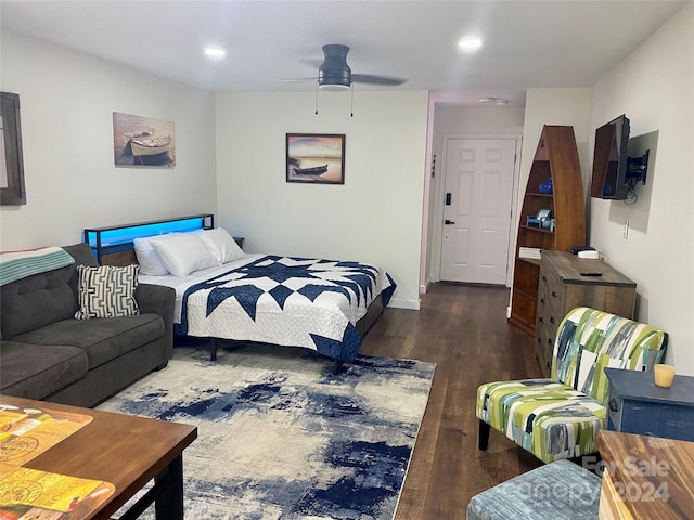 bedroom featuring dark hardwood / wood-style flooring and ceiling fan