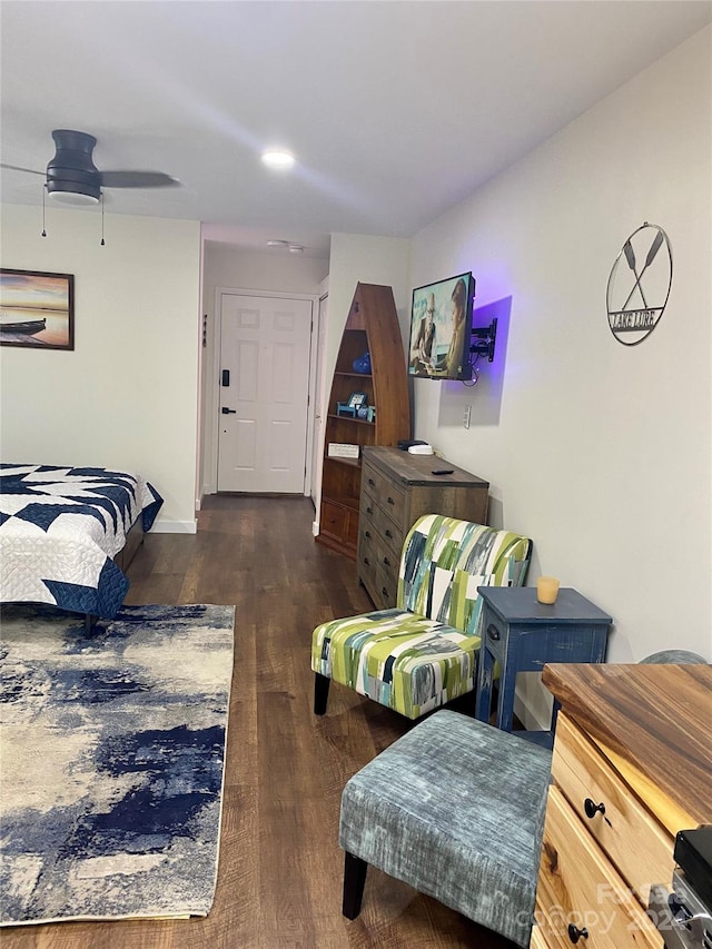 bedroom featuring ceiling fan and dark wood-type flooring