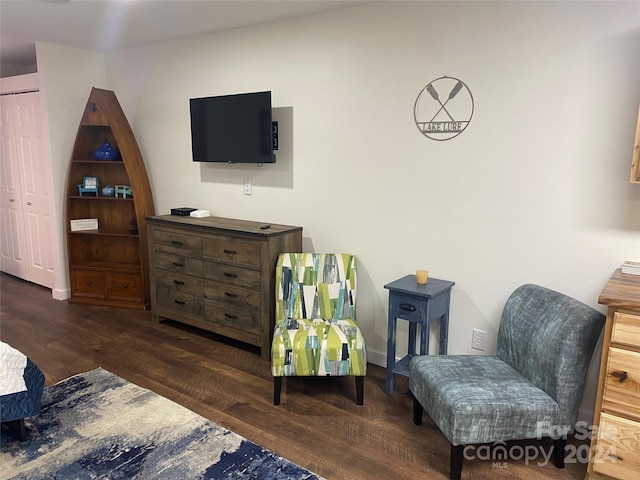 living area with dark hardwood / wood-style floors