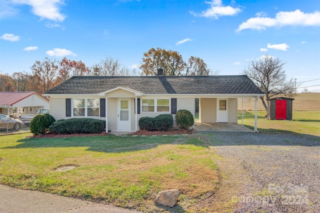 ranch-style home with a front lawn and a carport