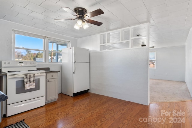 kitchen featuring white appliances, white cabinets, crown molding, ceiling fan, and light hardwood / wood-style floors