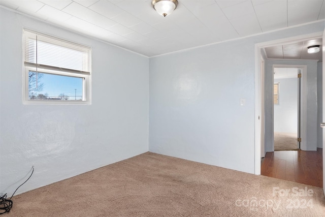 empty room featuring wood-type flooring