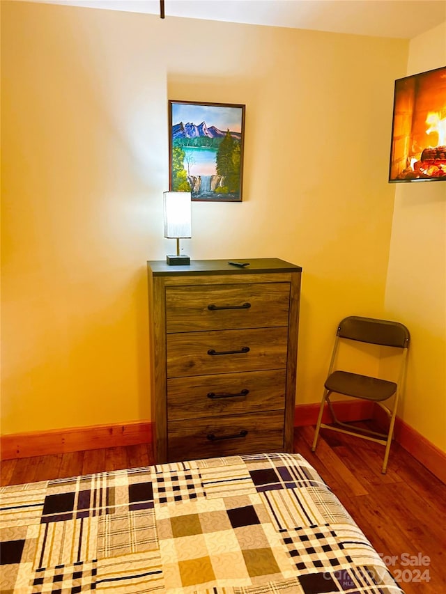 unfurnished bedroom featuring hardwood / wood-style flooring