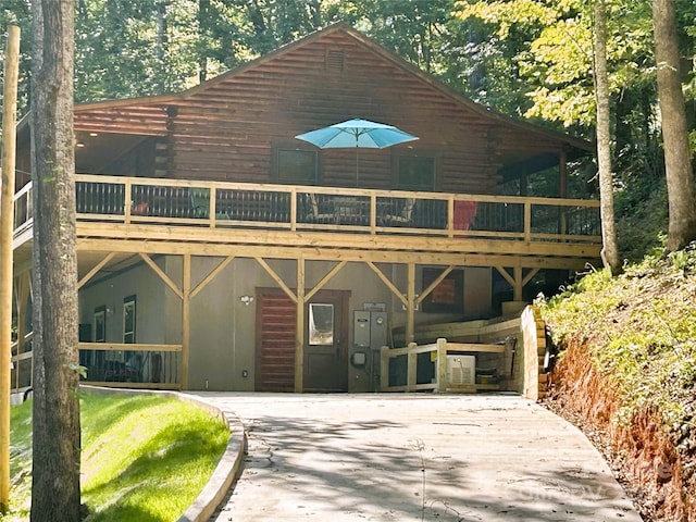 229 Seton Rd, Lake Lure, NC 28746 - view of front facade featuring concrete driveway, a wooden deck, and a carport