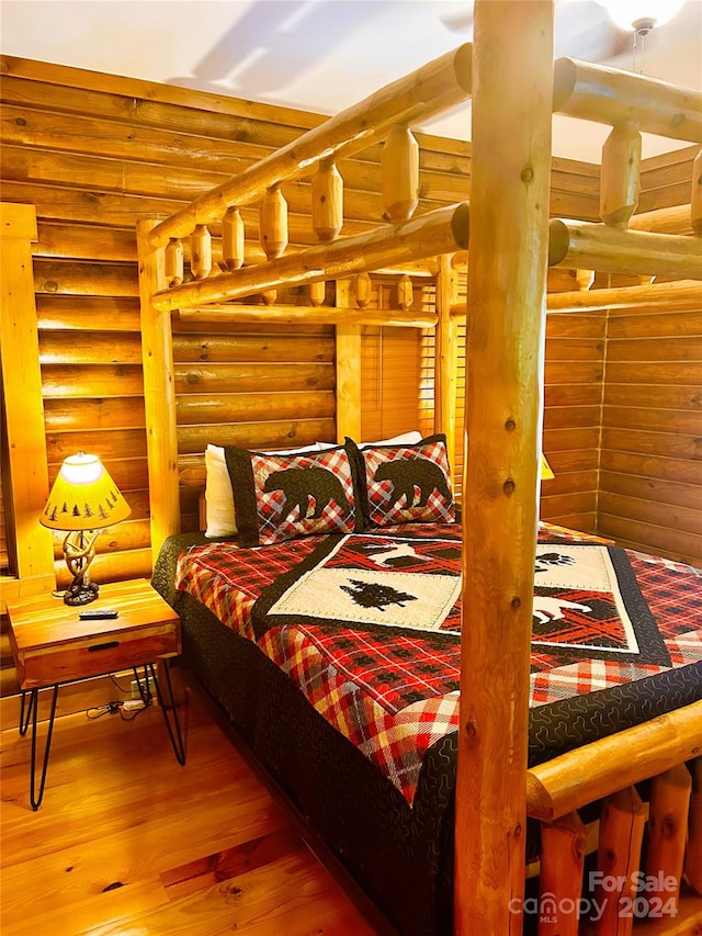 229 Seton Rd, Lake Lure, NC 28746 - bedroom featuring rustic walls and wood finished floors