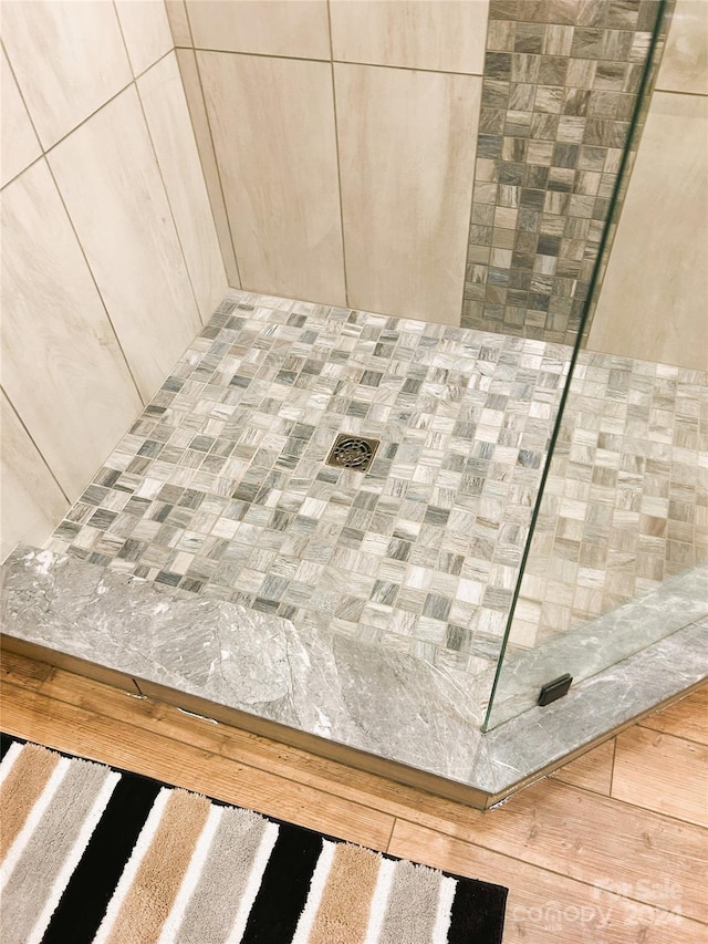 229 Seton Rd, Lake Lure, NC 28746 - bathroom view of tiled shower and wood finished floors