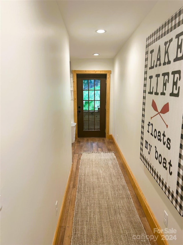 entryway with hardwood / wood-style flooring