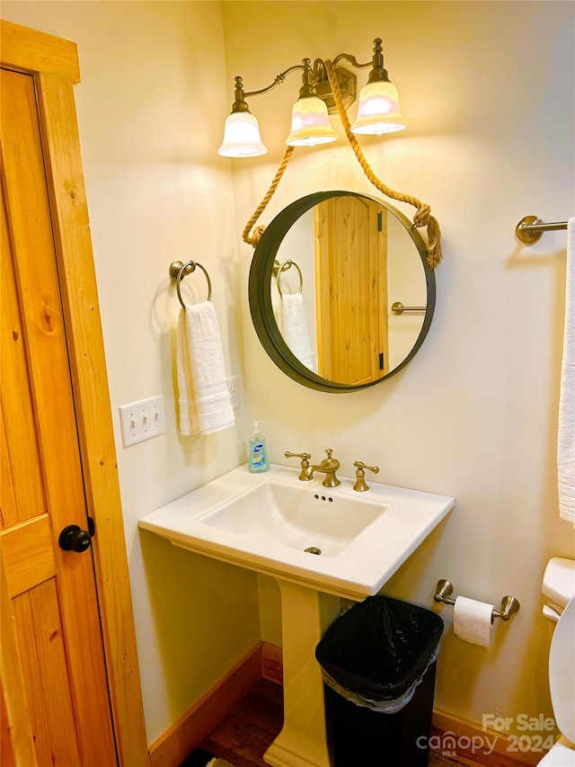 229 Seton Rd, Lake Lure, NC 28746 - half bathroom featuring toilet and wood finished floors