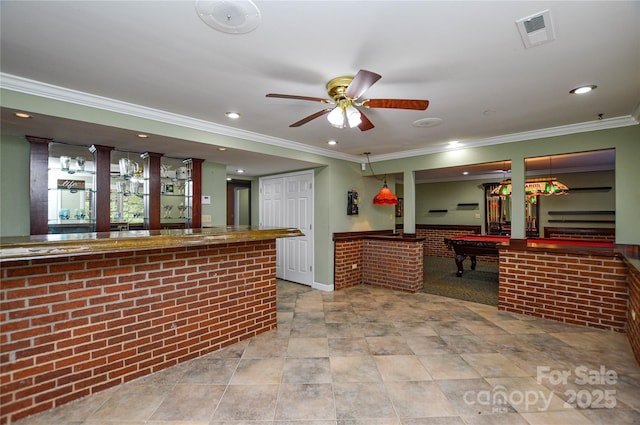 interior space featuring crown molding, ceiling fan, brick wall, and billiards