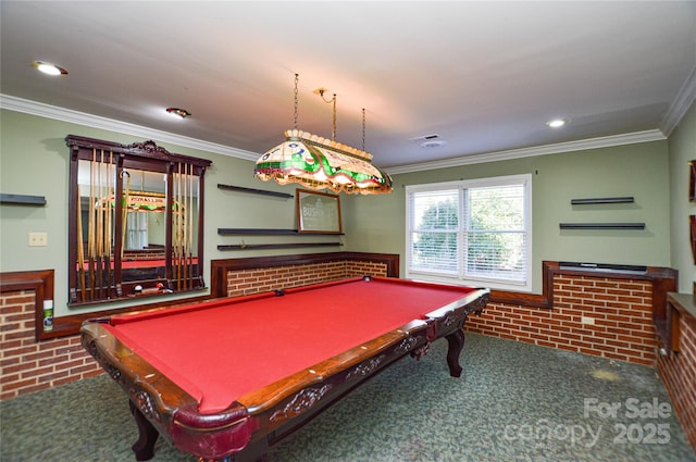 game room with brick wall, dark carpet, pool table, and ornamental molding