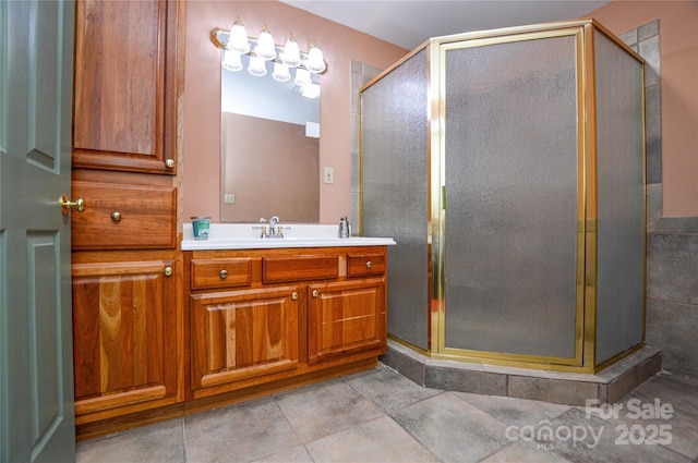 bathroom with vanity, tile patterned floors, and a shower with door