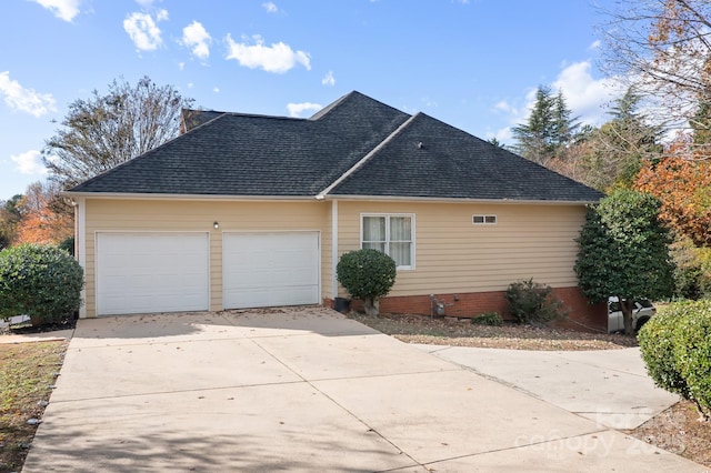 view of side of property featuring a garage