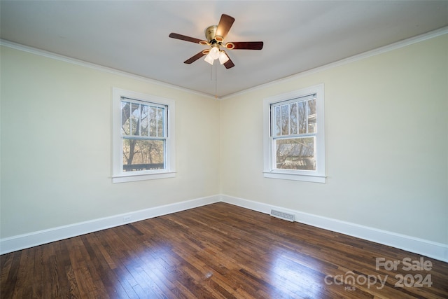 empty room featuring ceiling fan, dark hardwood / wood-style flooring, and ornamental molding