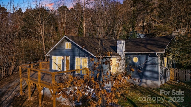 view of back house at dusk