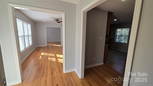 hall with light hardwood / wood-style flooring