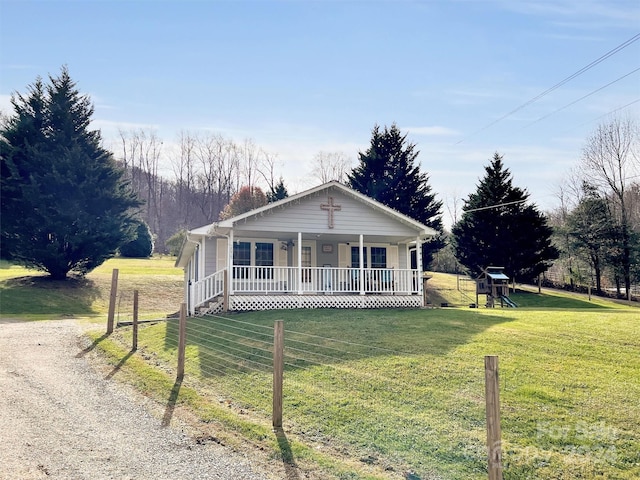 single story home featuring a front yard and a porch