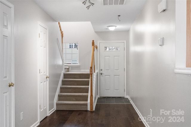 stairs with wood-type flooring