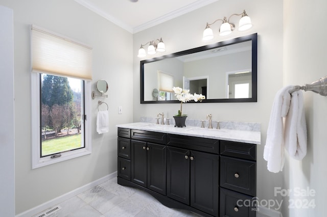 bathroom with vanity and ornamental molding