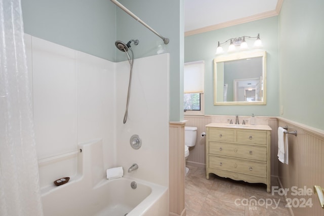 full bathroom featuring ornamental molding, vanity, shower / bath combo with shower curtain, tile patterned flooring, and toilet