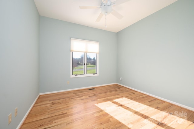 unfurnished room with ceiling fan and light wood-type flooring