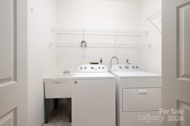 washroom with washing machine and clothes dryer