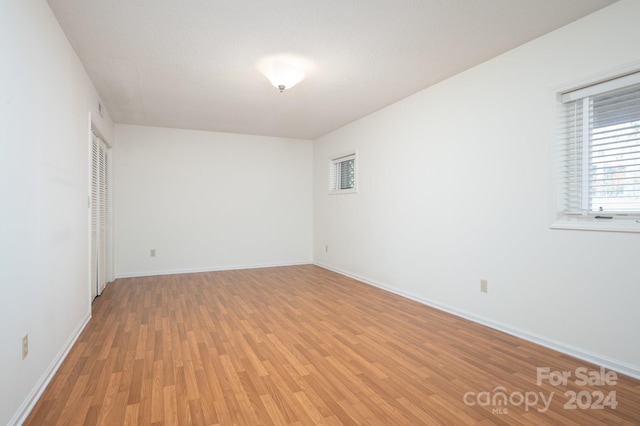 unfurnished room featuring light hardwood / wood-style flooring