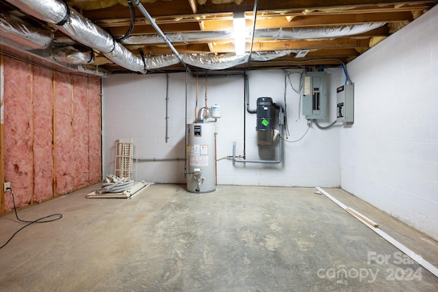 basement featuring electric panel and gas water heater