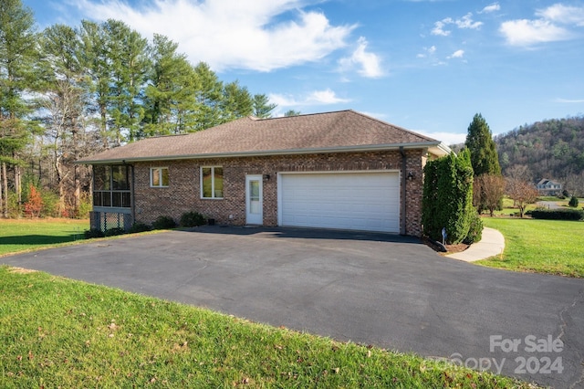 view of home's exterior featuring a yard and a garage