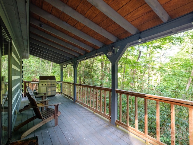 wooden deck featuring area for grilling